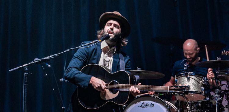 singer playing guitar